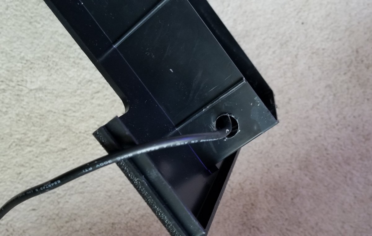 Large hole in hood for power cord.jpg