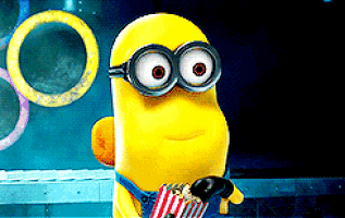 Minion laughing with pop corn.gif