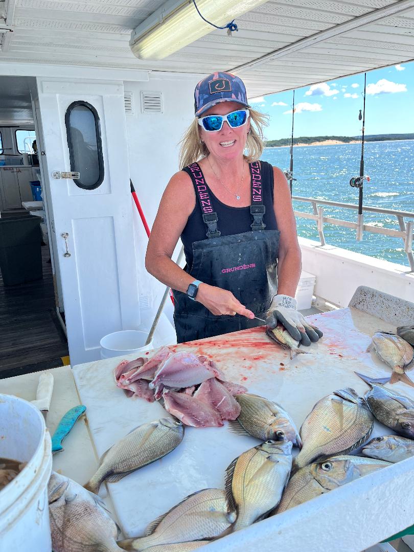 Capt Rachelle cleaning fish.jpg